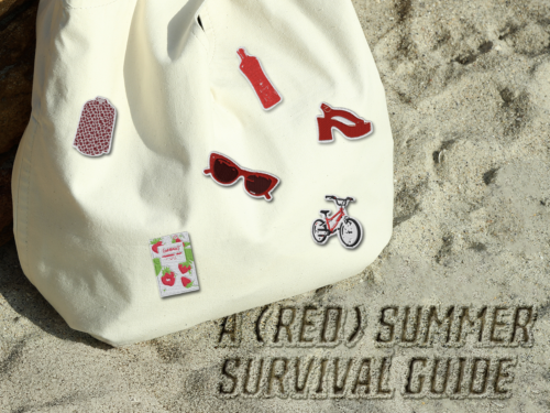 White tote bag with patches featuring (RED) products in the sand.